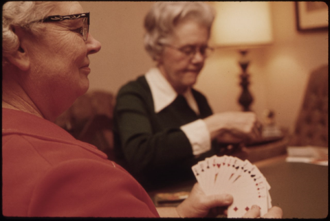 two older ladies playing cards